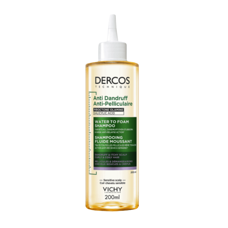 A 200ml bottle of Vichy Dercos Technique Anti Dandruff Shampoo, featuring a clear bottle showing the golden liquid inside, a white cap, and a green and white label.