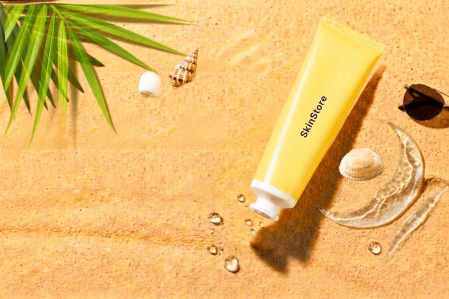 Sand with a water splash and a tube of cream